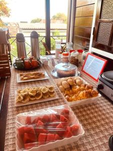 a table with many different types of food on it at Pousada Boldró Home in Fernando de Noronha +107 photos