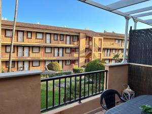 a view of a building from a balcony at playa ancha in San Luis de Sabinillas