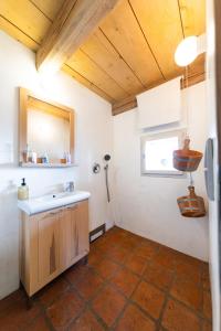a bathroom with a sink and a mirror at Chalet Němčice in Němčice +38 photos