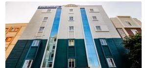 a building with a sign on top of it at Hotel Silverkey luxury Rooms in Hyderabad