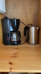 a coffee maker sitting on top of a wooden shelf at Bitihorn in Beitostøl