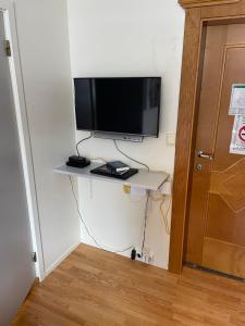 a television sitting on a table in a room at Bitihorn in Beitostøl