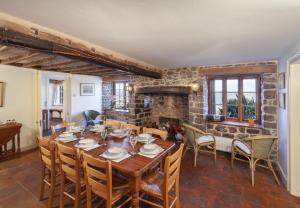 a dining room with a wooden table and chairs at The Crows Nest Porlock Weir in Porlock