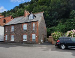 a brick house with a window on top of it at Seagulls Rest Minehead in Minehead