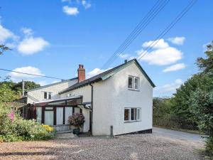 an image of a white house at Forge Cottage Wootton Courtenay in Minehead
