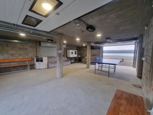 an empty room with a ping pong table in it at Blue River, sojenica na Dunavu in Belgrade