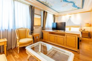 a hotel room with a bed and a tv at Grand Hotel del Parco in Stezzano