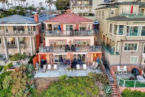 an aerial view of a large house with a patio at Oceanfront Condo, Private Patio, Beach Access, BBQ in Carlsbad +18 photos