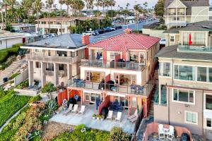 an aerial view of a house with a balcony at Oceanfront Condo, Private Patio, Beach Access, BBQ in Carlsbad