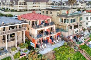 an aerial view of a house with a roof at Oceanfront Condo, Private Patio, Beach Access, BBQ in Carlsbad