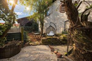 a house with a bird cage in the yard at Suite Spa Privatif & Jacuzzi XXL route des vins à Chatenois in Châtenois