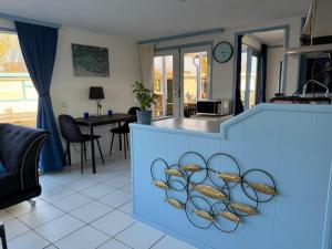 a kitchen with a blue counter with baskets on it at Floating Hideaway in Leimuiden