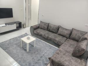 a living room with a couch and a table at SunShine in Quseir