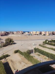a view of an empty parking lot with buildings at SunShine in Quseir