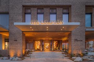 a building with a sign that reads the convention at The Compton in Bentonville