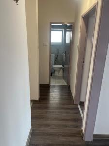 a hallway leading to a bathroom with a toilet at Apartment Boro in Selce +30 photos