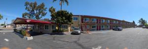 a parking lot in front of a building at Cloud 9 Motel - Cypress, Buena Park in Cypress