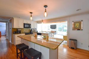 a kitchen with a large island in the middle at Beautiful Property w Separate Apartment in Brewster