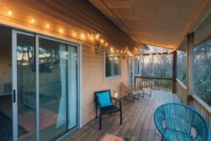 a porch with chairs and lights on a house at The Sanctuary Company Johnson City in Johnson City