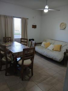 a living room with a table and a couch at Casa Chardonnay in Luzuriaga