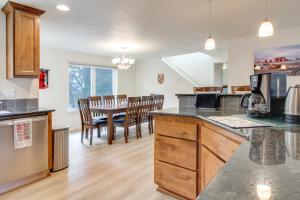 a kitchen and dining room with a table and chairs at Spacious Bandon Getaway - 2 Blocks to Ocean! in Bandon