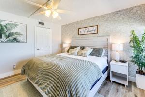 a bedroom with a bed and a ceiling fan at Beachfront! Indian Rocks Beach Condo w/ Balcony in Clearwater Beach +20 photos