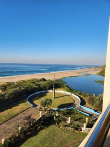 an aerial view of a beach and a body of water at Lescalier 513 Luxury sea facing unit in Amanzimtoti