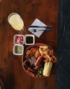 a table with a bowl of food and a glass of milk at Inti Amanta Lodge in Sigchos