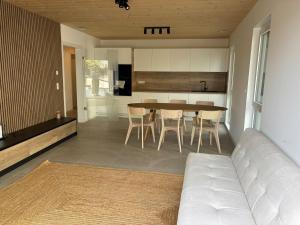 a kitchen and dining room with a table and chairs at NEW - Mullerthal Basecamp - Sleeps 6 in Beaufort
