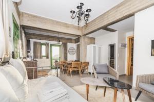 a living room with a couch and a table at GAIA - Boutique Retreat in Marathopoli