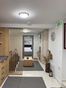 a living room with a table and a bed at The Central Retreat 1 in Mytilene