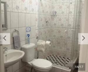 a bathroom with a toilet and a sink and a shower at Hollywood Heights Accommodation in Barrydale