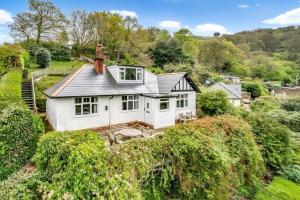 an aerial view of a white house on a hill at West Wind Porlock in Porlock