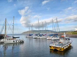 a group of boats docked in a body of water at Keld Apartment Porlock in Porlock