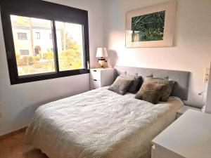 a bedroom with a large bed with a window at Casa Tranquila La Duquesa in Manilva +11 photos