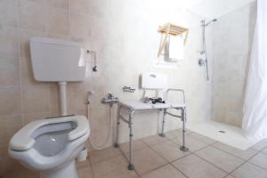 a bathroom with a toilet and a shower and a sink at Locanda del Borgo in Langa in Prunetto +69 photos