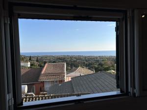 a window view of the ocean from a house at Stavroula's House in Argyrádes