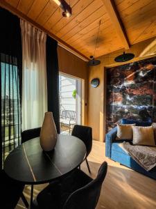 a living room with a table and chairs and a bed at Casa Georgia in Kefalos
