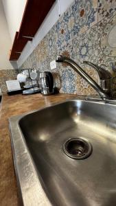 a kitchen sink with a faucet on top of it at Departmento en Barrio Antiguo in Monterrey +35 photos