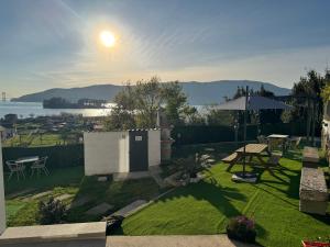 a garden with a table and an umbrella at Casa Cuartel in Redondela