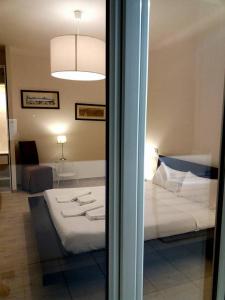 a view of a bedroom with a bed in a room at Flat via Irlanda 26 in Quartu Sant'Elena