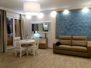 a living room with a couch and a table at Flat via Irlanda 26 in Quartu Sant'Elena