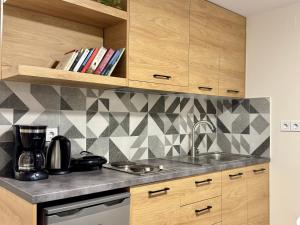 a kitchen with a sink and a counter top at The Central Retreat 2 in Mytilene