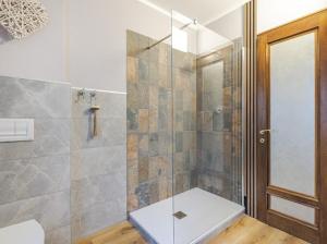 a bathroom with a shower with a glass door at Trieste Sea Life in Trieste +63 photos