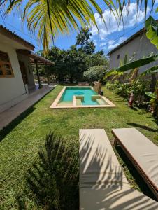 a swimming pool in the yard of a house at Hotelito Sri Lanka in Weligama