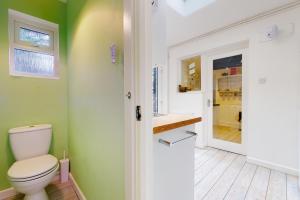a bathroom with a toilet and a sink at High Bank Porlock in Porlock +22 photos
