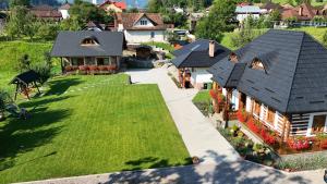 an overhead view of a house with a green lawn at Sadova Village - Casa Maria in Sadova