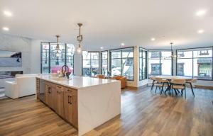 an open kitchen and living room with a table and chairs at Christiania Condominiums- CoralTree Residence Collection in Vail