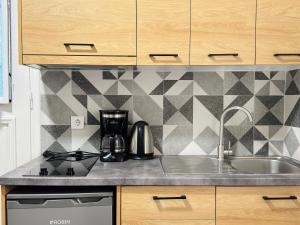 a kitchen with a sink and a counter top at The Central Retreat 4 in Mytilene