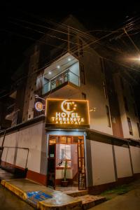 a hotel with a sign in front of a building at HOTEL TERRANOVA Abancay in Abancay +43 photos
